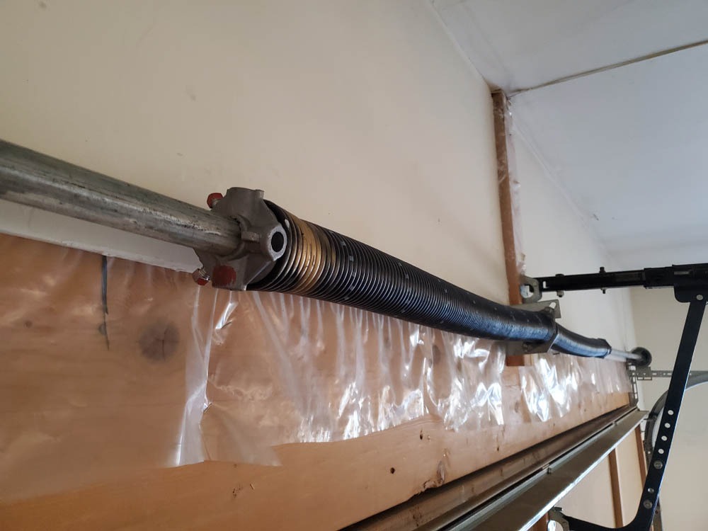 Garage door spring installed on torsion tube