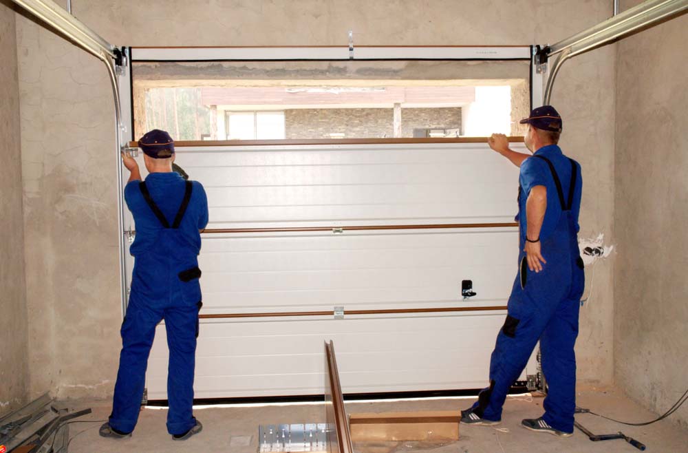 technician installing garage door