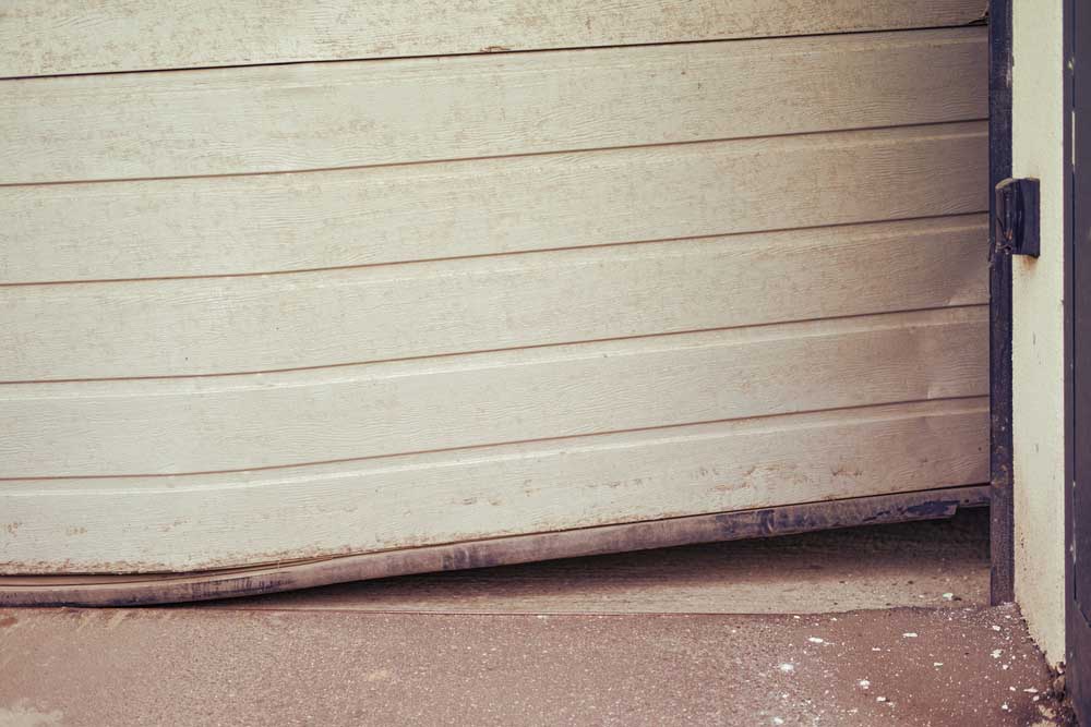 Damaged garage door repair Southlake, TX.